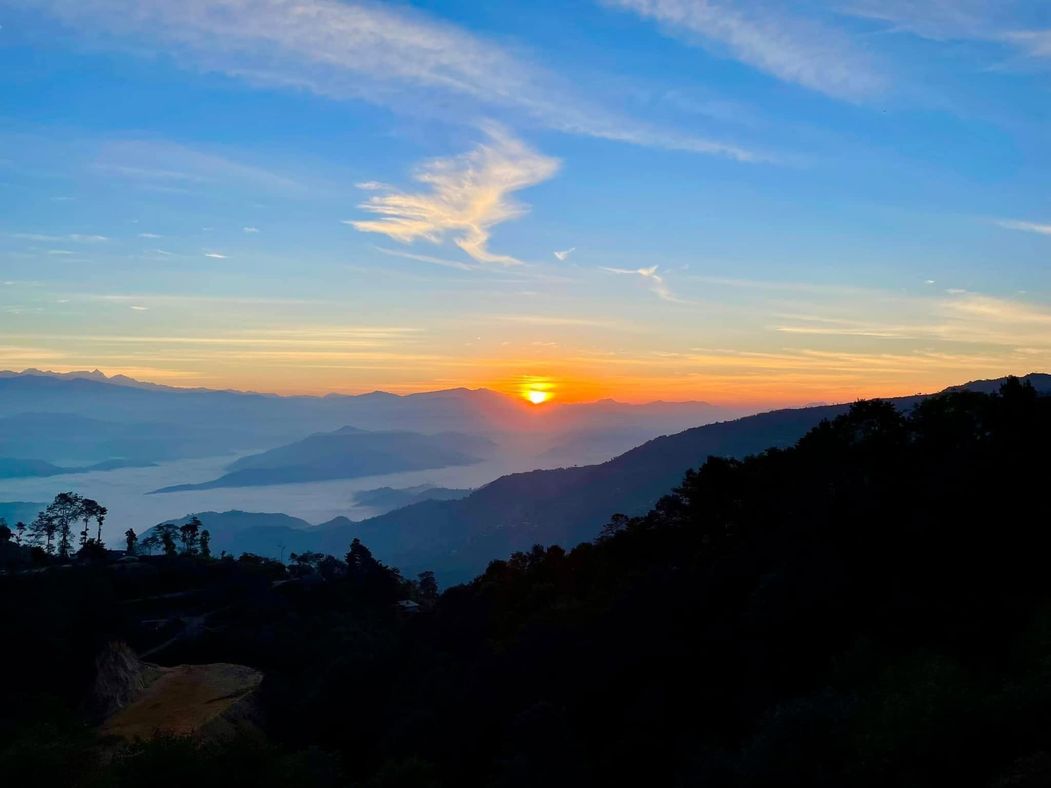 Sunrise over the Himalayan mountains as seen from Chisapani